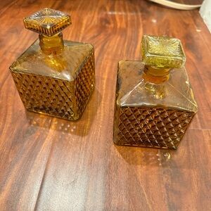 Two vintage decanter and brown vintage whiskey bottle